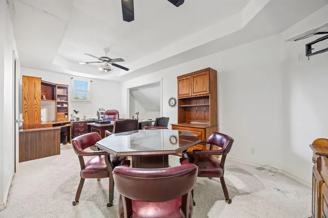 a view of a dining room with furniture and window