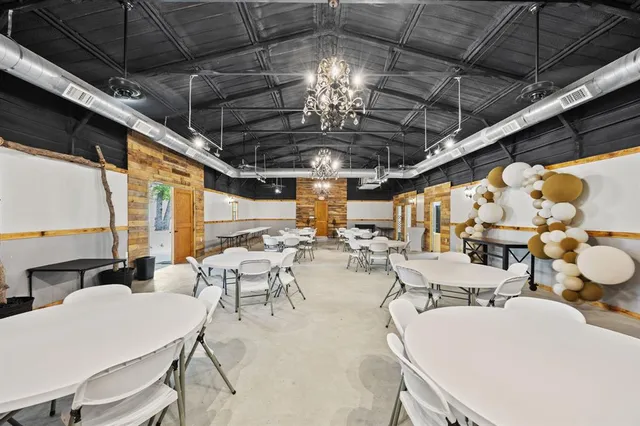 a view of a garage with chair and white walls