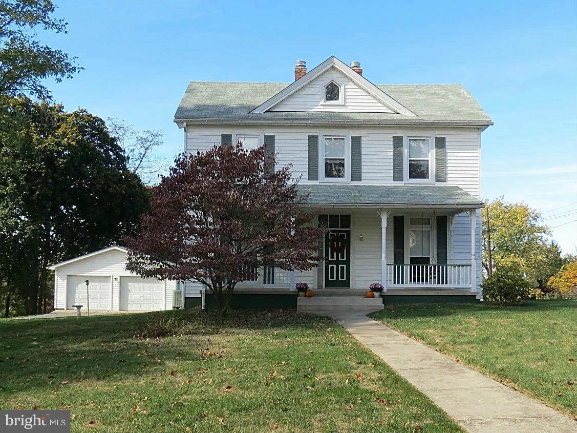 306 Buffalo Road Mount Airy, MD 21771 - Photo 3 of 30 a front view of a house with a yard