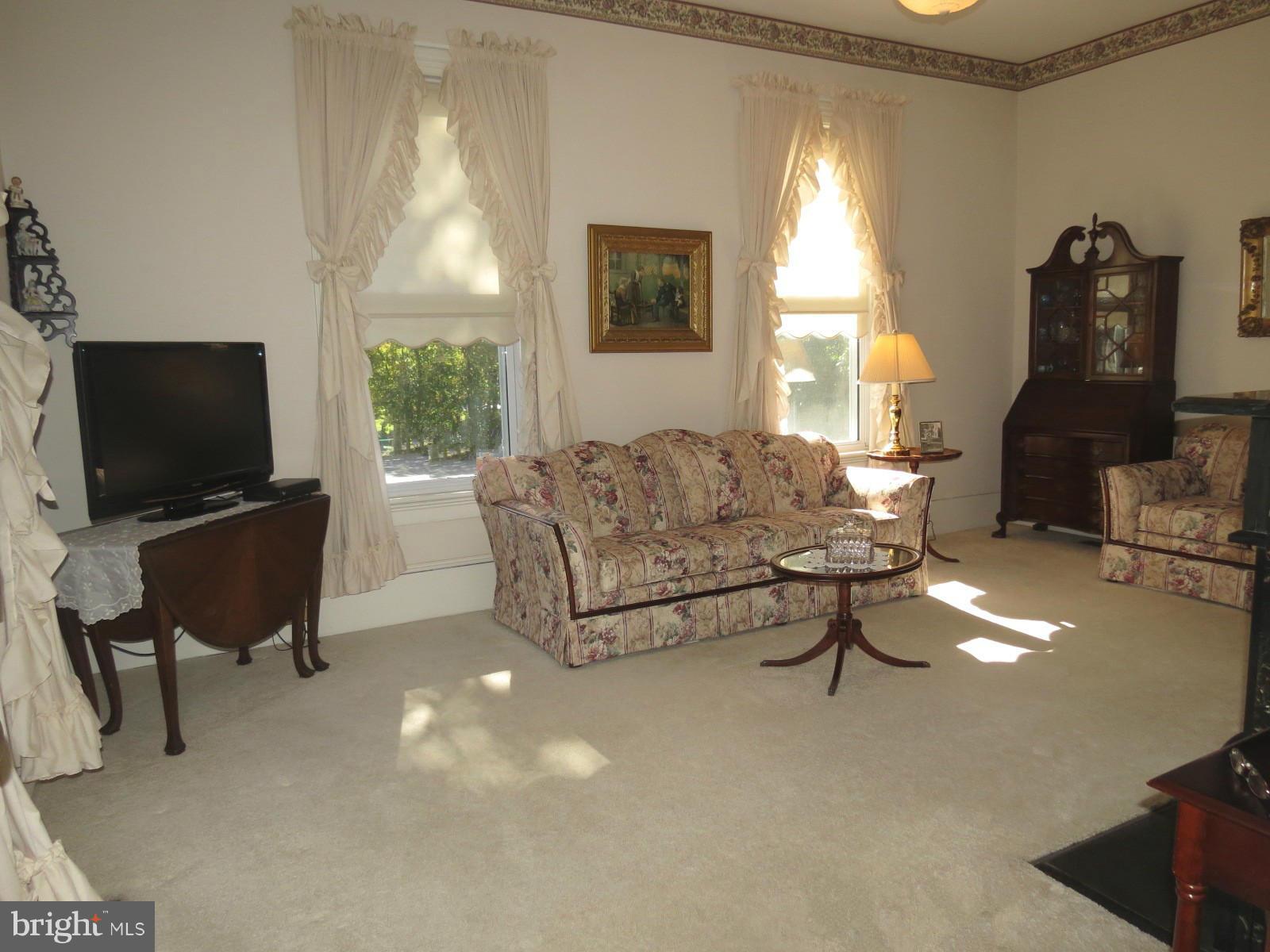 306 Buffalo Road Mount Airy, MD 21771 - Photo 5 of 30 a living room with furniture and a flat screen tv