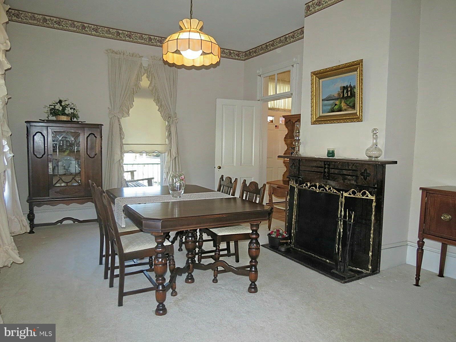 306 Buffalo Road Mount Airy, MD 21771 - Photo 8 of 30 a view of a dining room with furniture and chandelier