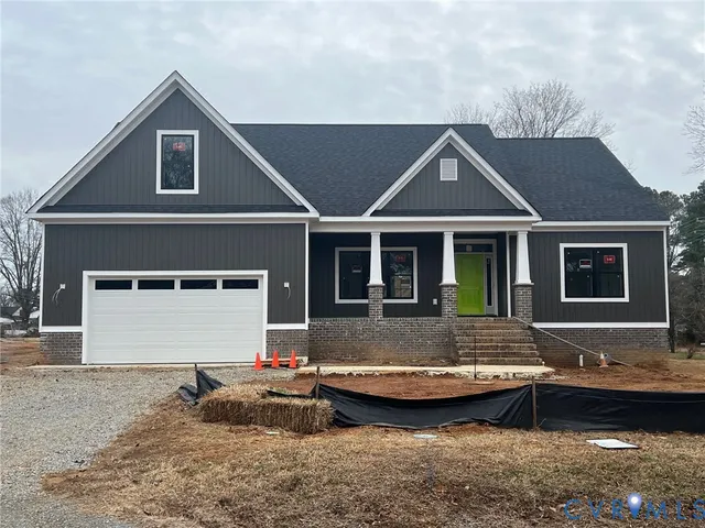 a front view of a house with garage