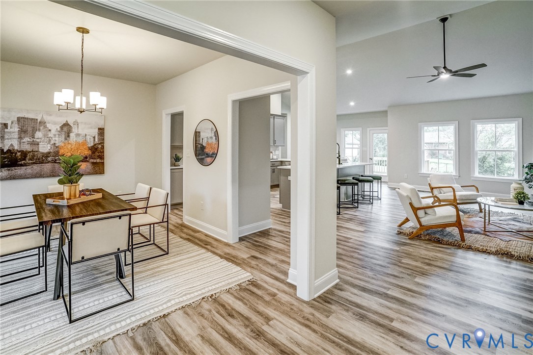 2301 Larkwood Road Henrico, VA 23294 - Photo 11 of 23 a living room with furniture and a chandelier