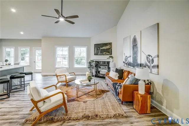 a living room with furniture and a fireplace
