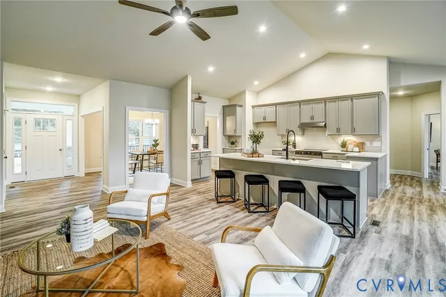 a kitchen with a stove a sink and a refrigerator