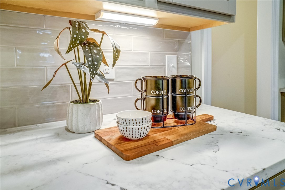 2301 Larkwood Road Henrico, VA 23294 - Photo 21 of 23 a table with a vase and chandelier