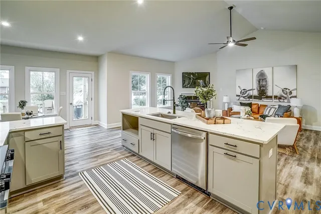 a view of a kitchen with a sink and living room