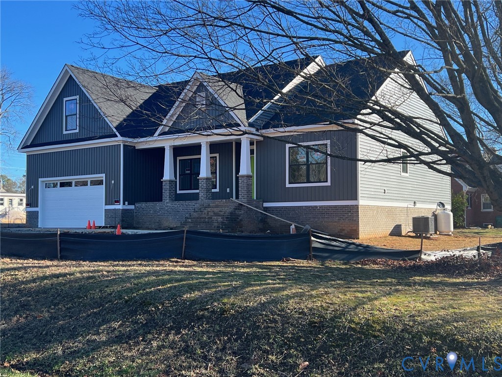 2301 Larkwood Road Henrico, VA 23294 - Photo 3 of 23 a front view of a house with a yard