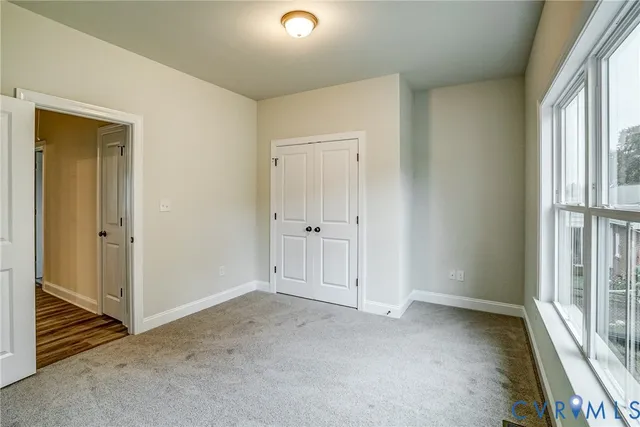 a view of a livingroom with wooden floor
