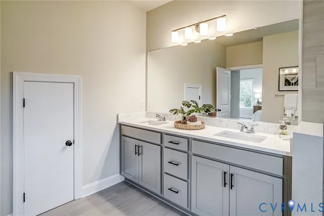 a living room with furniture a chandelier and a window