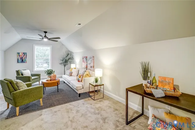 a living room with furniture a rug and a large window