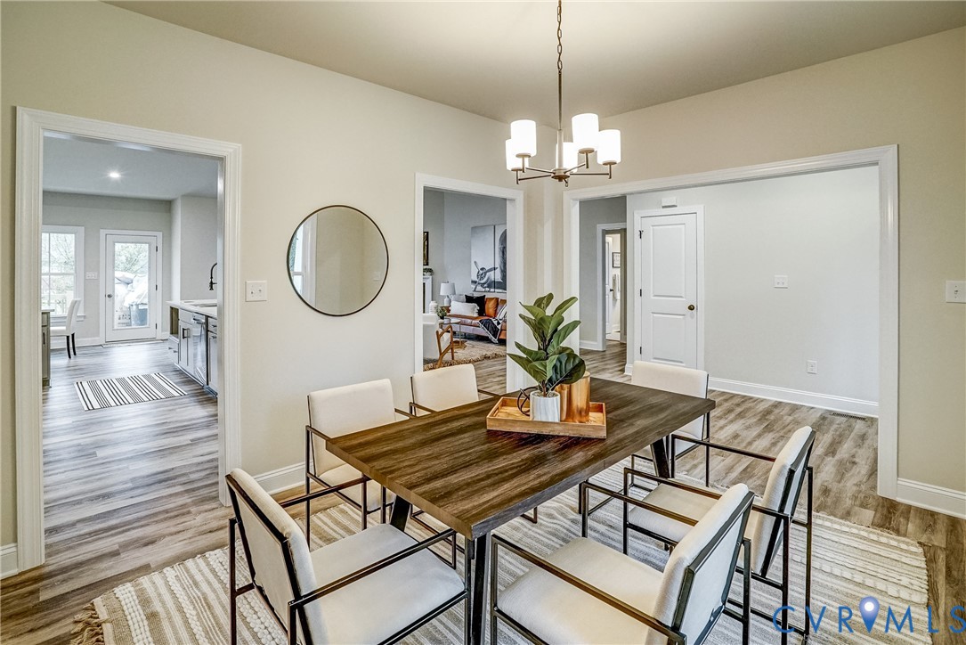 2301 Larkwood Road Henrico, VA 23294 - Photo 9 of 23 a view of a dining room with furniture and wooden floor
