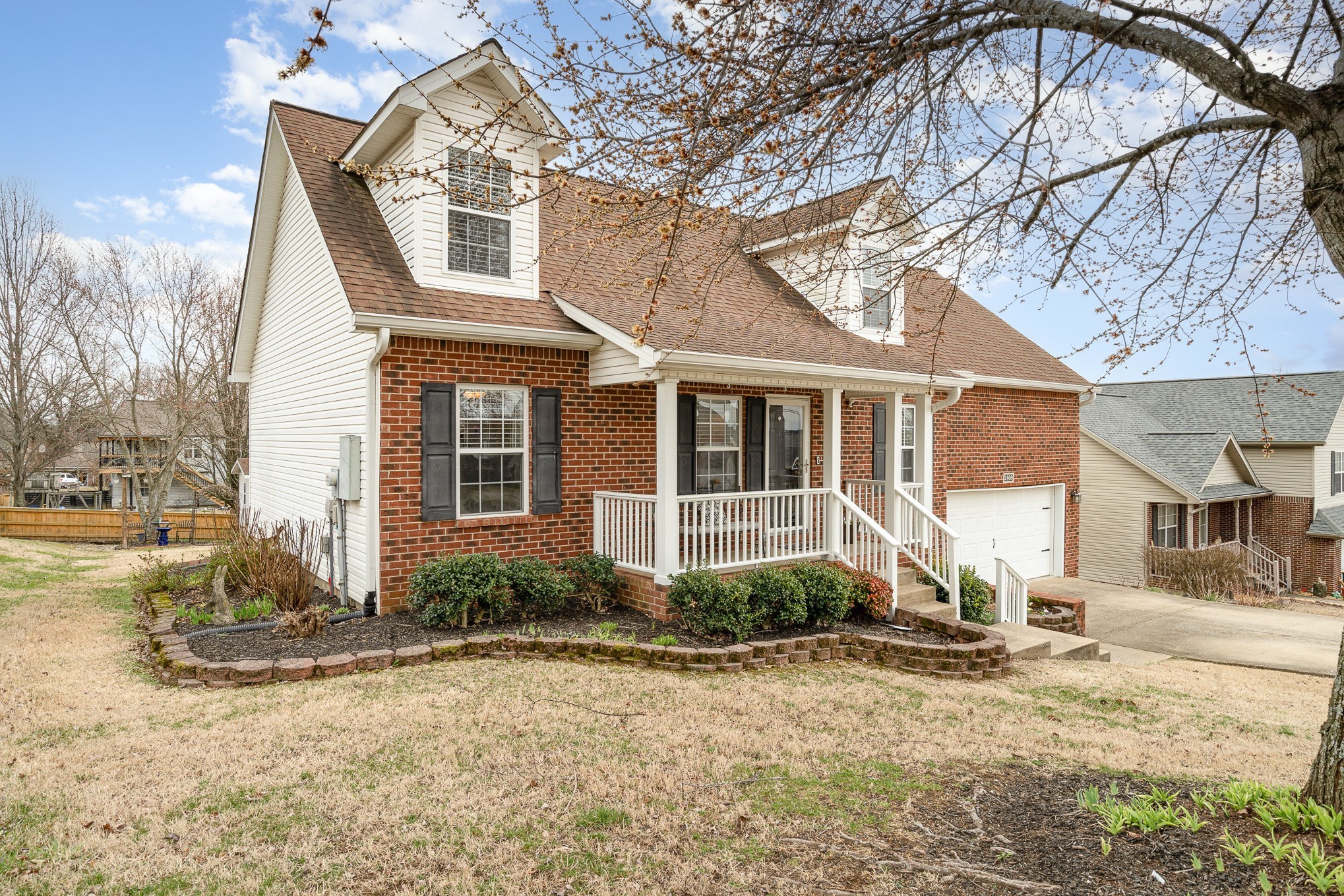 2408 Audelia Way Spring Hill, TN 37174 - Photo 2 of 25 a front view of a house with a yard and garage