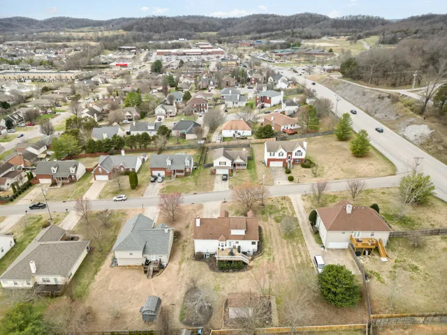 an aerial view of residential building and parking space