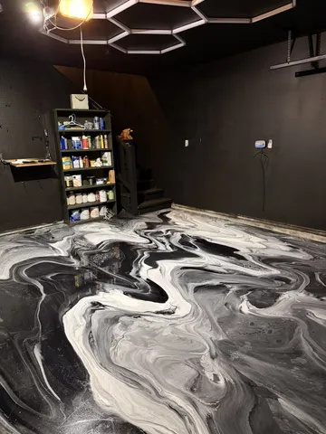 a room with water heater and a wooden floor