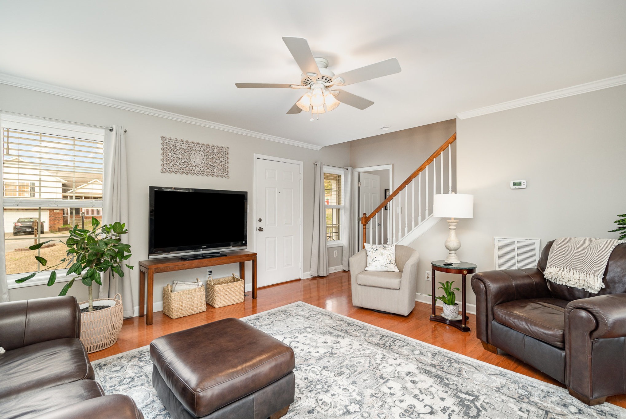 2408 Audelia Way Spring Hill, TN 37174 - Photo 3 of 25 a living room with furniture and a flat screen tv