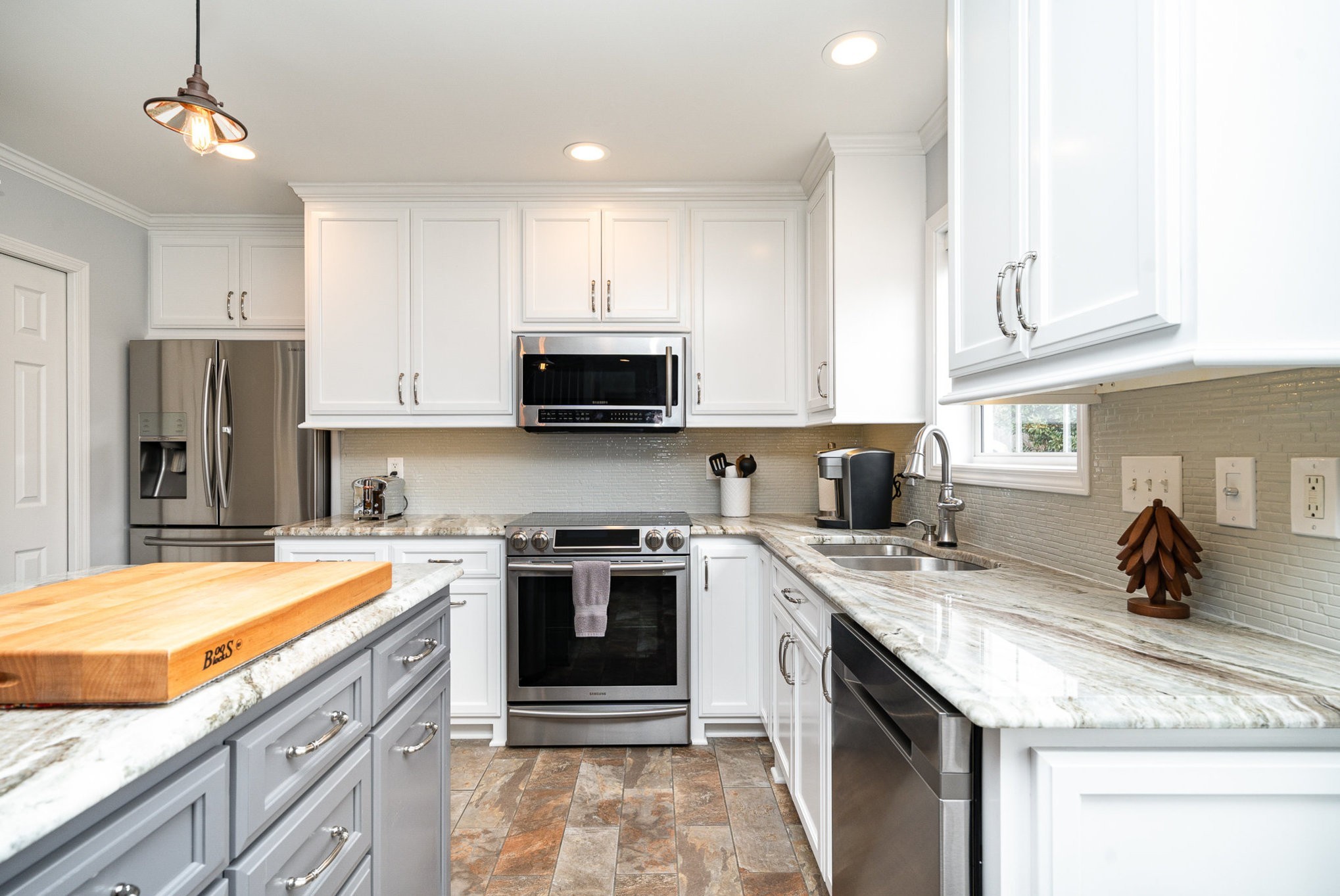 2408 Audelia Way Spring Hill, TN 37174 - Photo 7 of 25 a kitchen with a sink stove and refrigerator