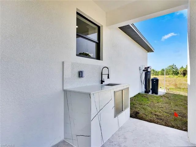 a kitchen with a sink and cabinets