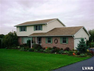 723 South Delps Road Bath, PA 18014 - Photo 1 of 3 a front view of house with yard and green space