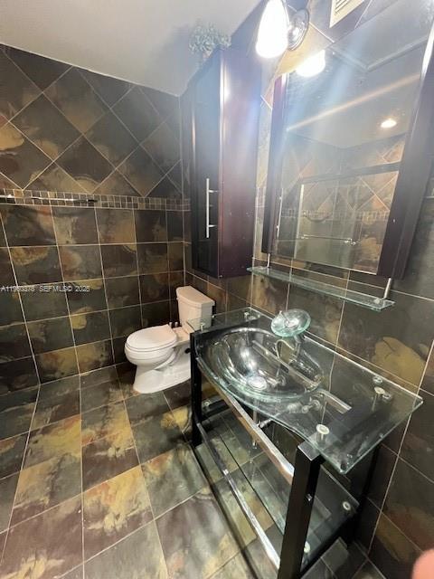 2103 Renaissance Boulevard, Unit 307 Miramar, FL 33025 - Photo 13 of 32 a bathroom with a sink toilet and shower