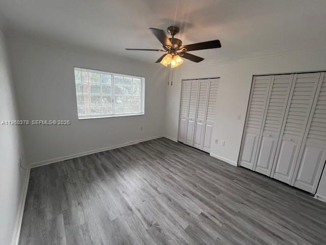 2103 Renaissance Boulevard, Unit 307 Miramar, FL 33025 - Photo 16 of 32 a view of an empty room with wooden floor and a window