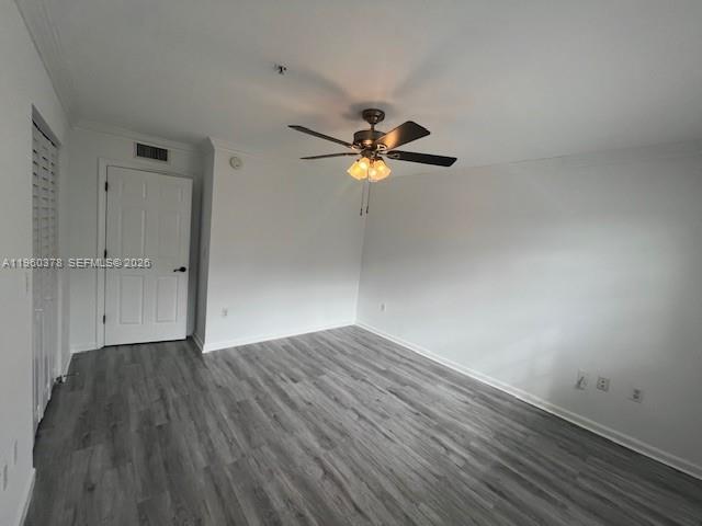 2103 Renaissance Boulevard, Unit 307 Miramar, FL 33025 - Photo 17 of 32 an empty room with wooden floor and a ceiling fan