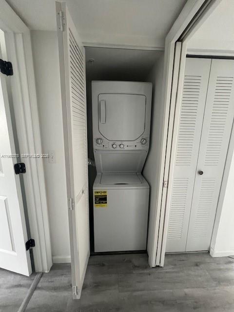 2103 Renaissance Boulevard, Unit 307 Miramar, FL 33025 - Photo 18 of 32 a utility room with wooden floor washer and dryer