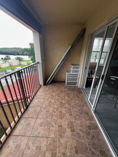 2103 Renaissance Boulevard, Unit 307 Miramar, FL 33025 - Photo 22 of 32 a view of an empty room with a staircase