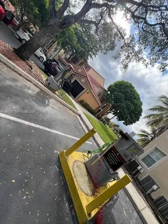 a view of a backyard with chairs
