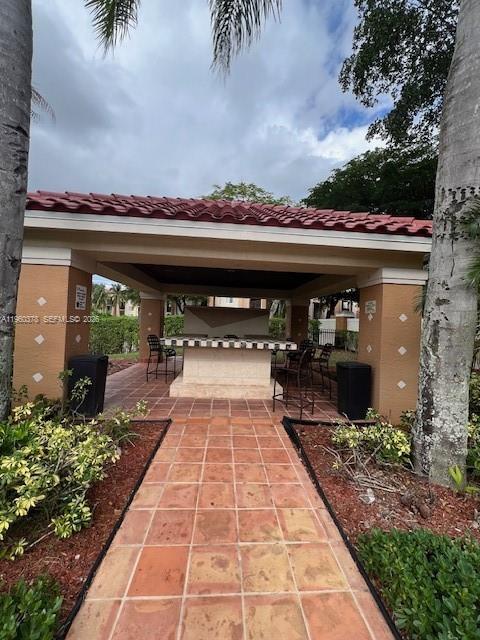 2103 Renaissance Boulevard, Unit 307 Miramar, FL 33025 - Photo 27 of 32 a view of a terrace with a garden