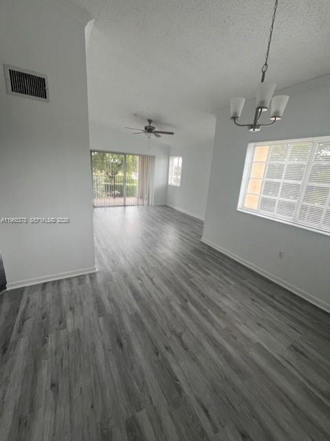 2103 Renaissance Boulevard, Unit 307 Miramar, FL 33025 - Photo 6 of 32 an empty room with wooden floor and windows