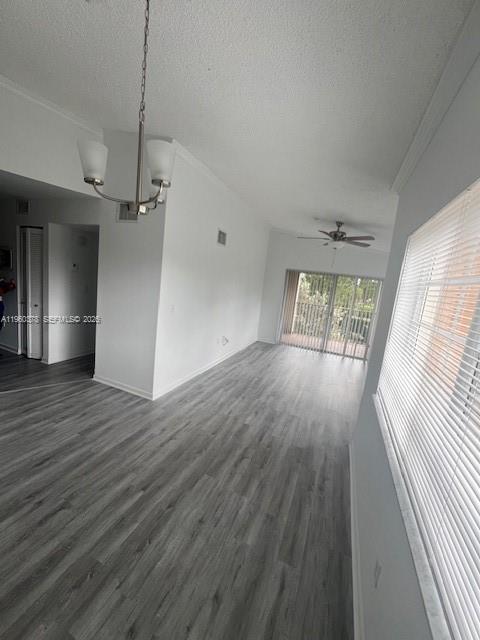 2103 Renaissance Boulevard, Unit 307 Miramar, FL 33025 - Photo 8 of 32 wooden floor in an empty room with a window