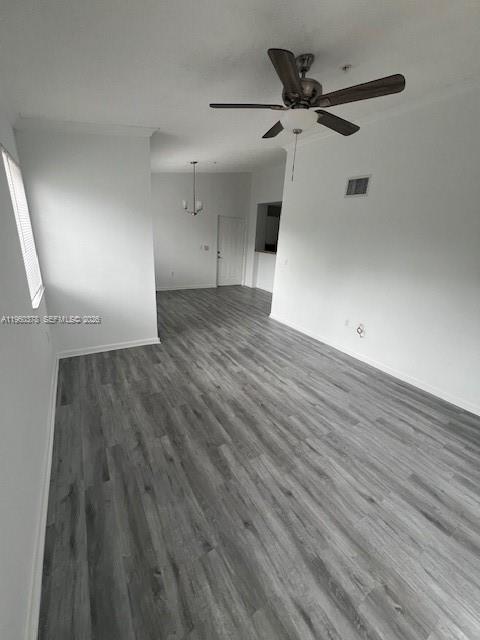 2103 Renaissance Boulevard, Unit 307 Miramar, FL 33025 - Photo 9 of 32 wooden floor in an empty room