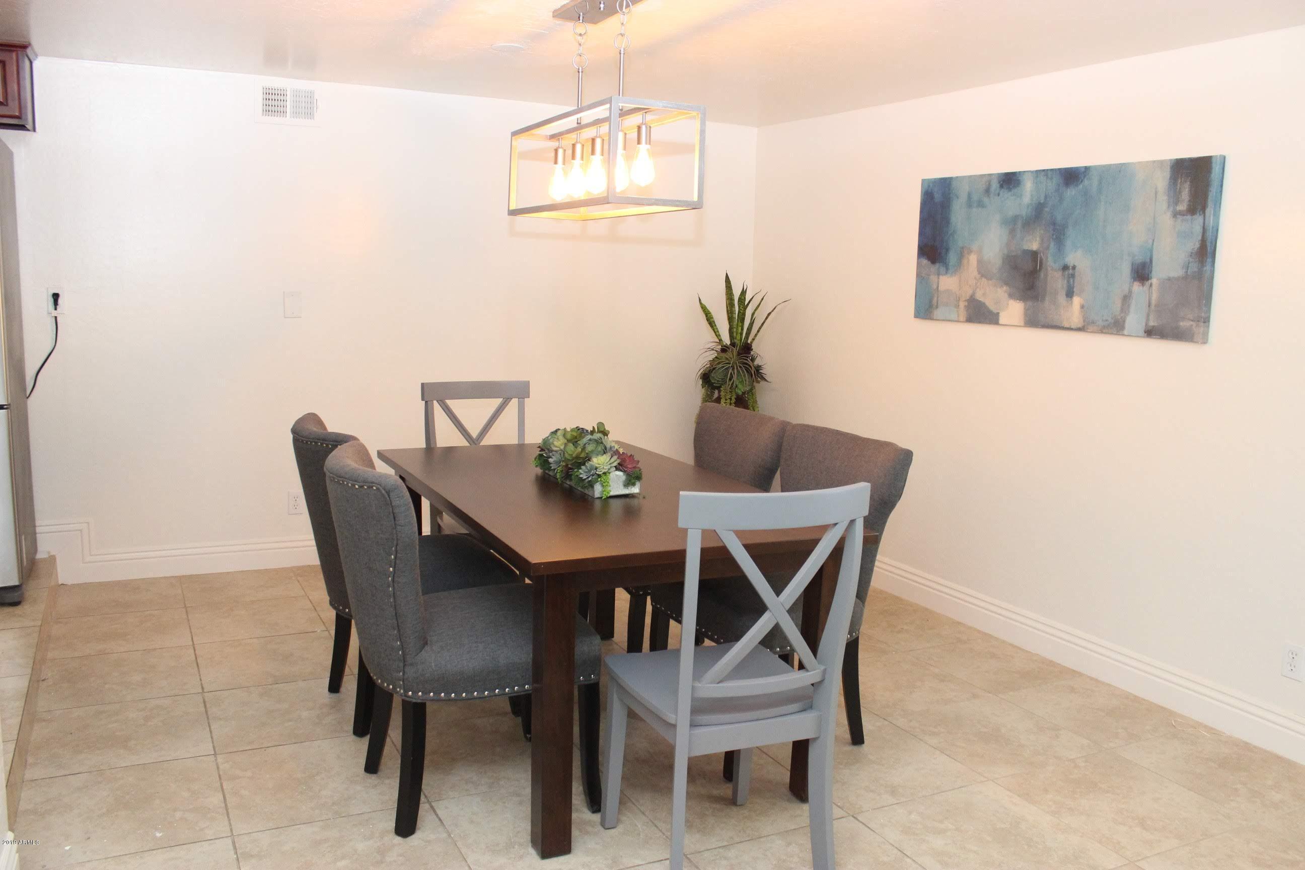 2827 East Osborn Road Phoenix, AZ 85016 - Photo 4 of 25 a dining room with furniture and window