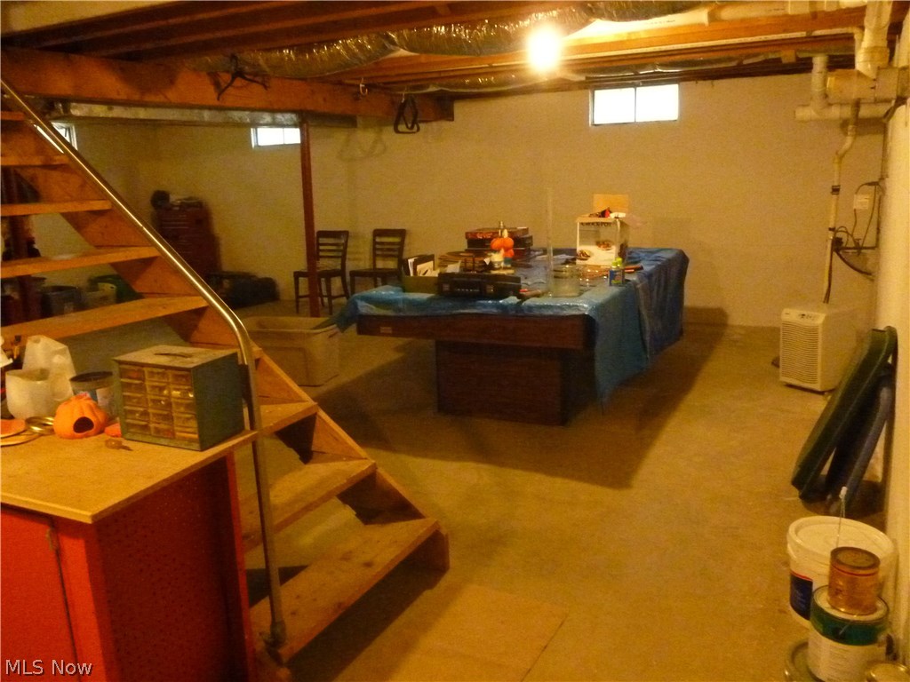 9467 Reed Road North Ridgeville, OH 44039 - Photo 35 of 35 Large basement has additional storage crawl space with concrete floor under family room. Slate billiard table remains with home
