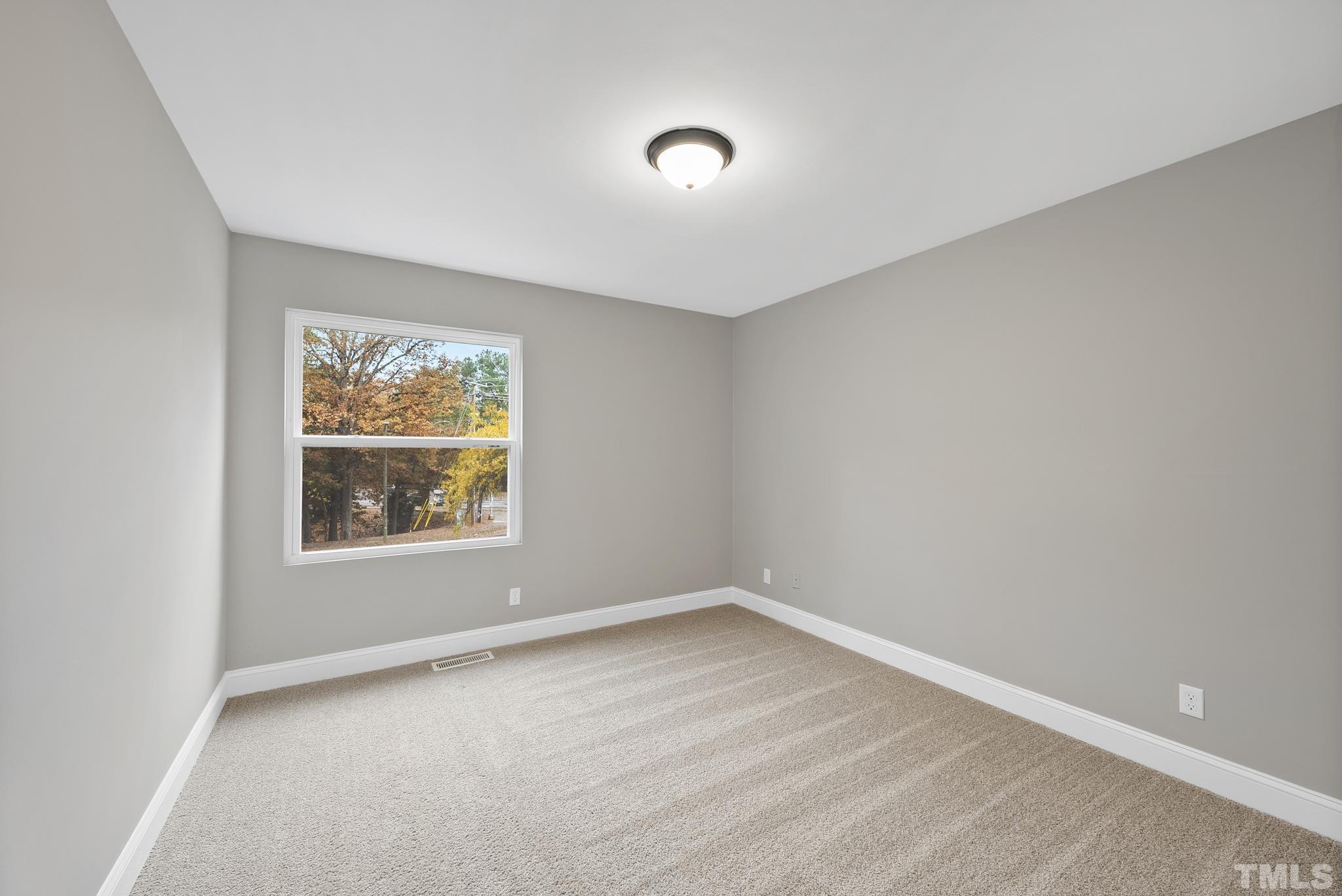 20 Lynn Road Raleigh, NC 27609 - Photo 22 of 29 an empty room with a window