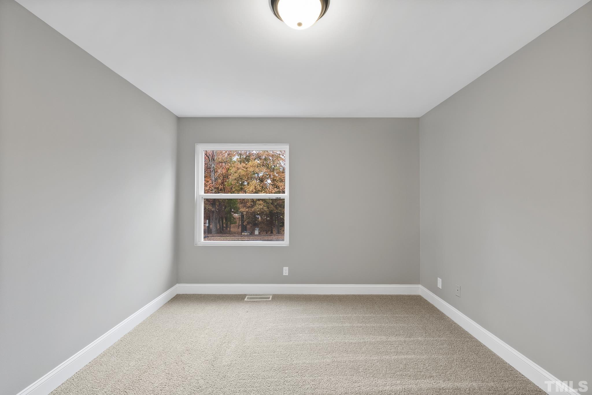 20 Lynn Road Raleigh, NC 27609 - Photo 23 of 29 an empty room with a window