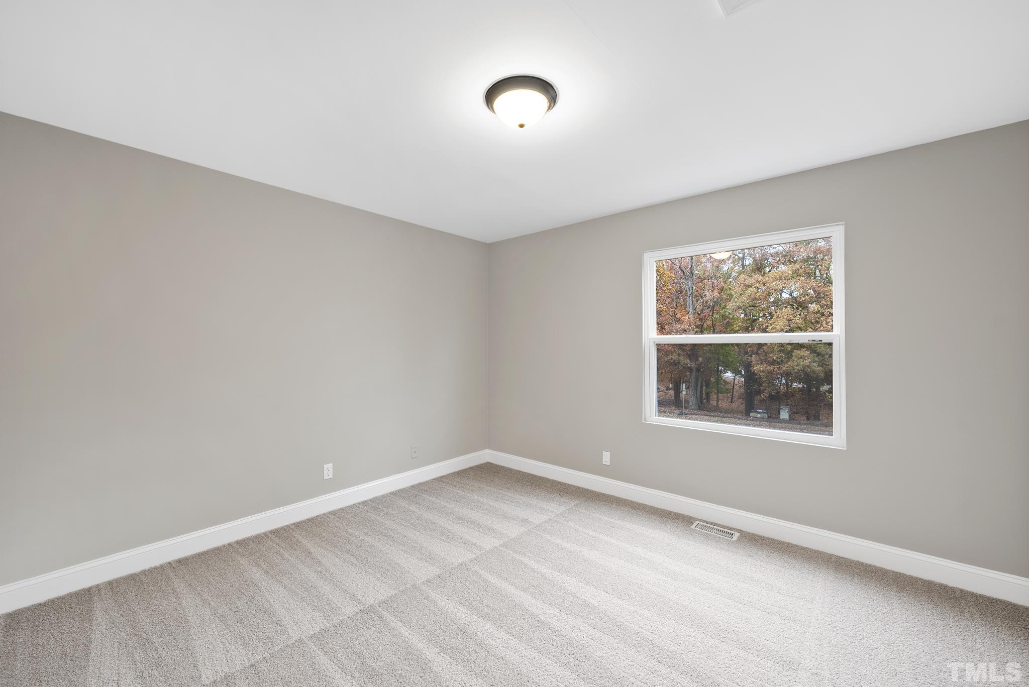 20 Lynn Road Raleigh, NC 27609 - Photo 24 of 29 an empty room with a window