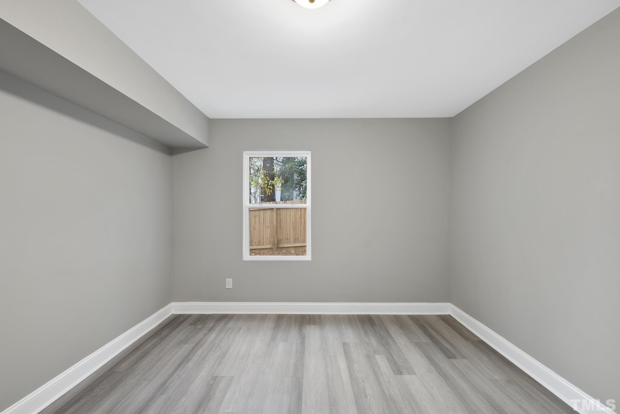 20 Lynn Road Raleigh, NC 27609 - Photo 26 of 29 an empty room with a window