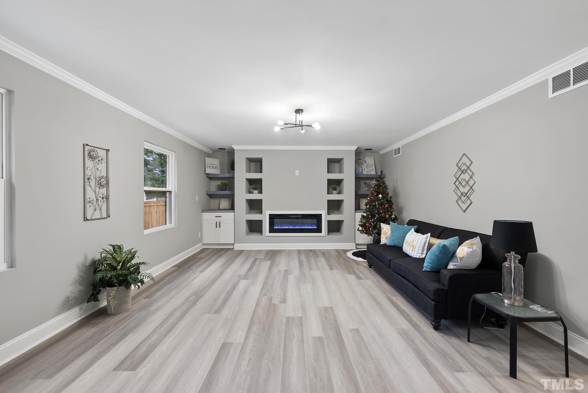 20 Lynn Road Raleigh, NC 27609 - Photo 5 of 29 a living room with furniture and a fireplace