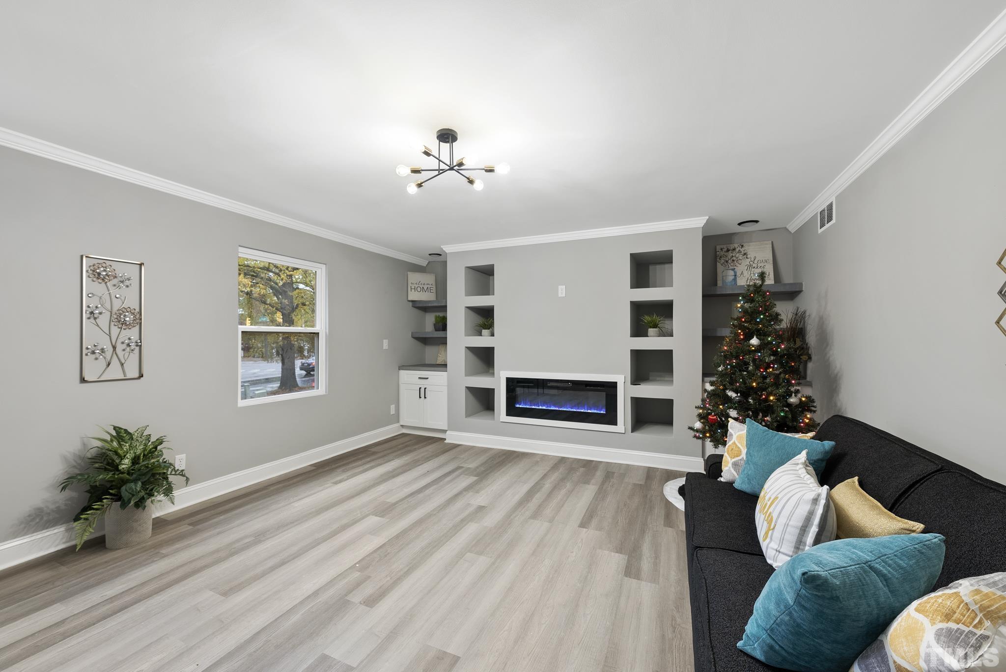20 Lynn Road Raleigh, NC 27609 - Photo 6 of 29 a living room with furniture and a fireplace