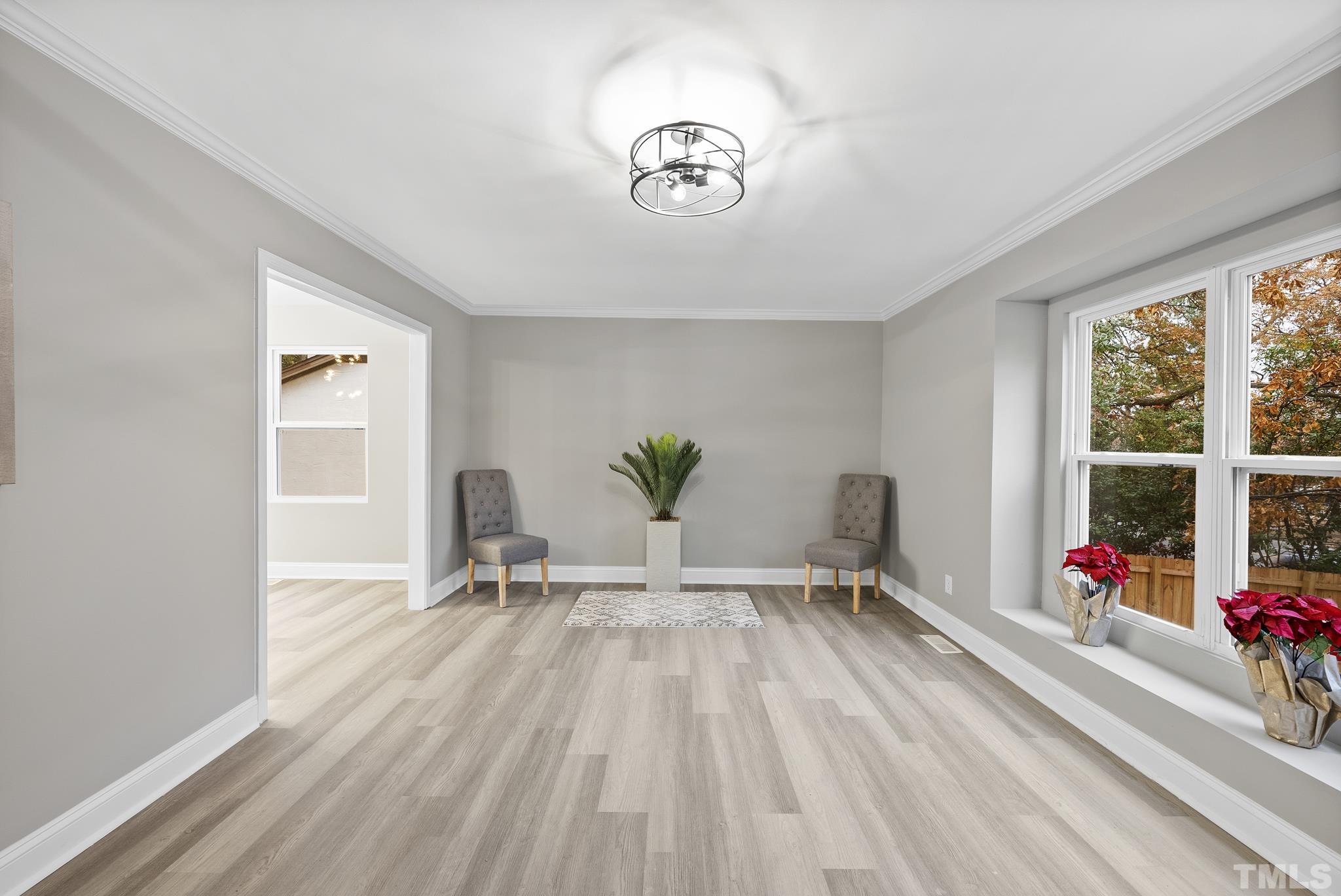 20 Lynn Road Raleigh, NC 27609 - Photo 8 of 29 a living room with furniture and a large window