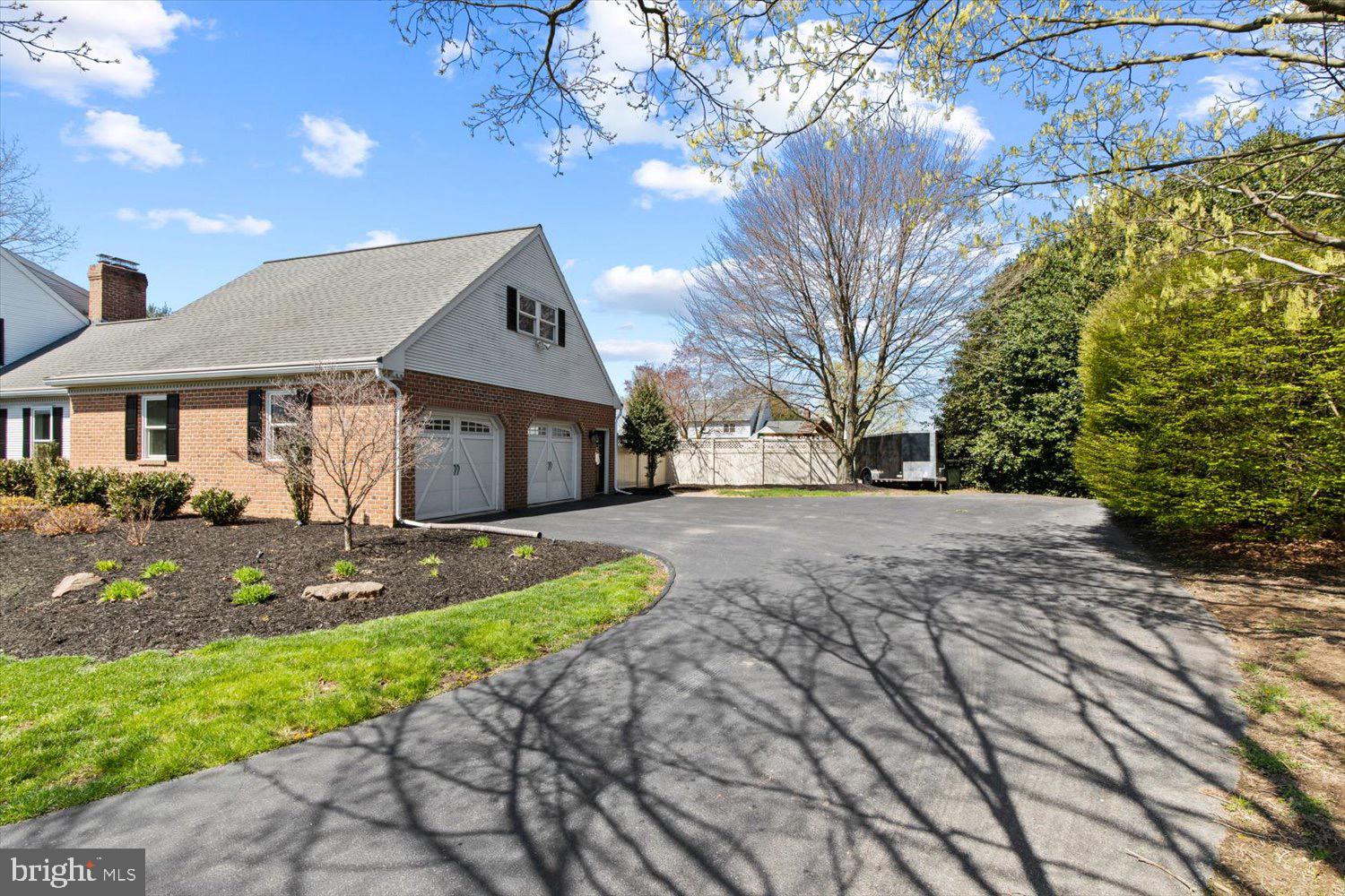 702 Buckwood Lane Lititz, PA 17543 - Photo 11 of 64 a front view of a house with a yard and garage