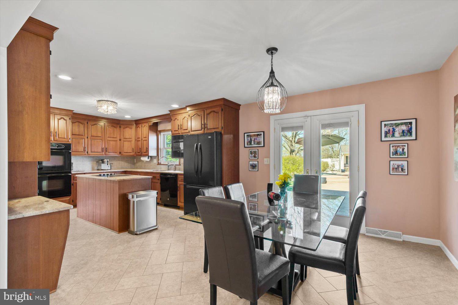 702 Buckwood Lane Lititz, PA 17543 - Photo 20 of 64 a view of a dining room with furniture window and wooden floor