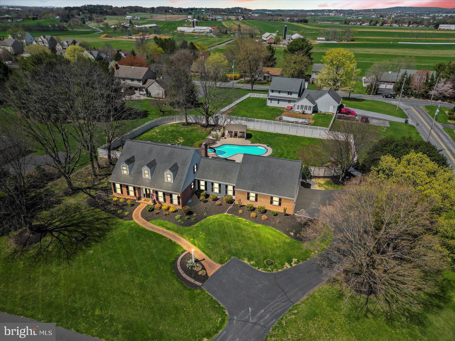 702 Buckwood Lane Lititz, PA 17543 - Photo 2 of 64 an aerial view of a house with a garden and lake view