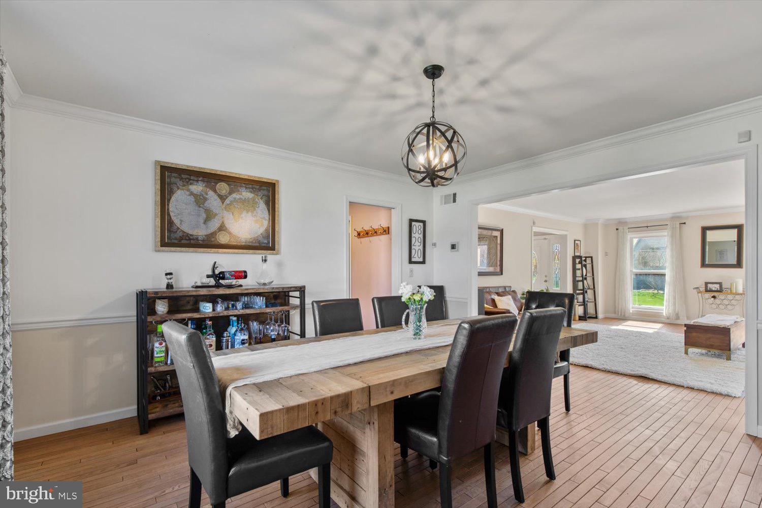 702 Buckwood Lane Lititz, PA 17543 - Photo 23 of 64 a view of a dining room with furniture wooden floor and chandelier