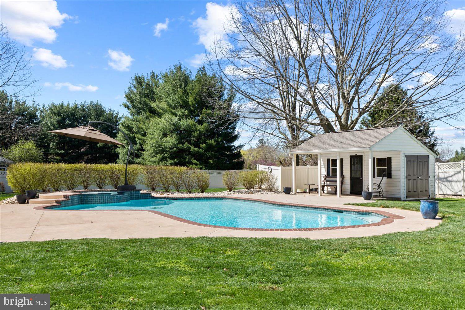 702 Buckwood Lane Lititz, PA 17543 - Photo 3 of 64 a front view of house with yard and swimming pool