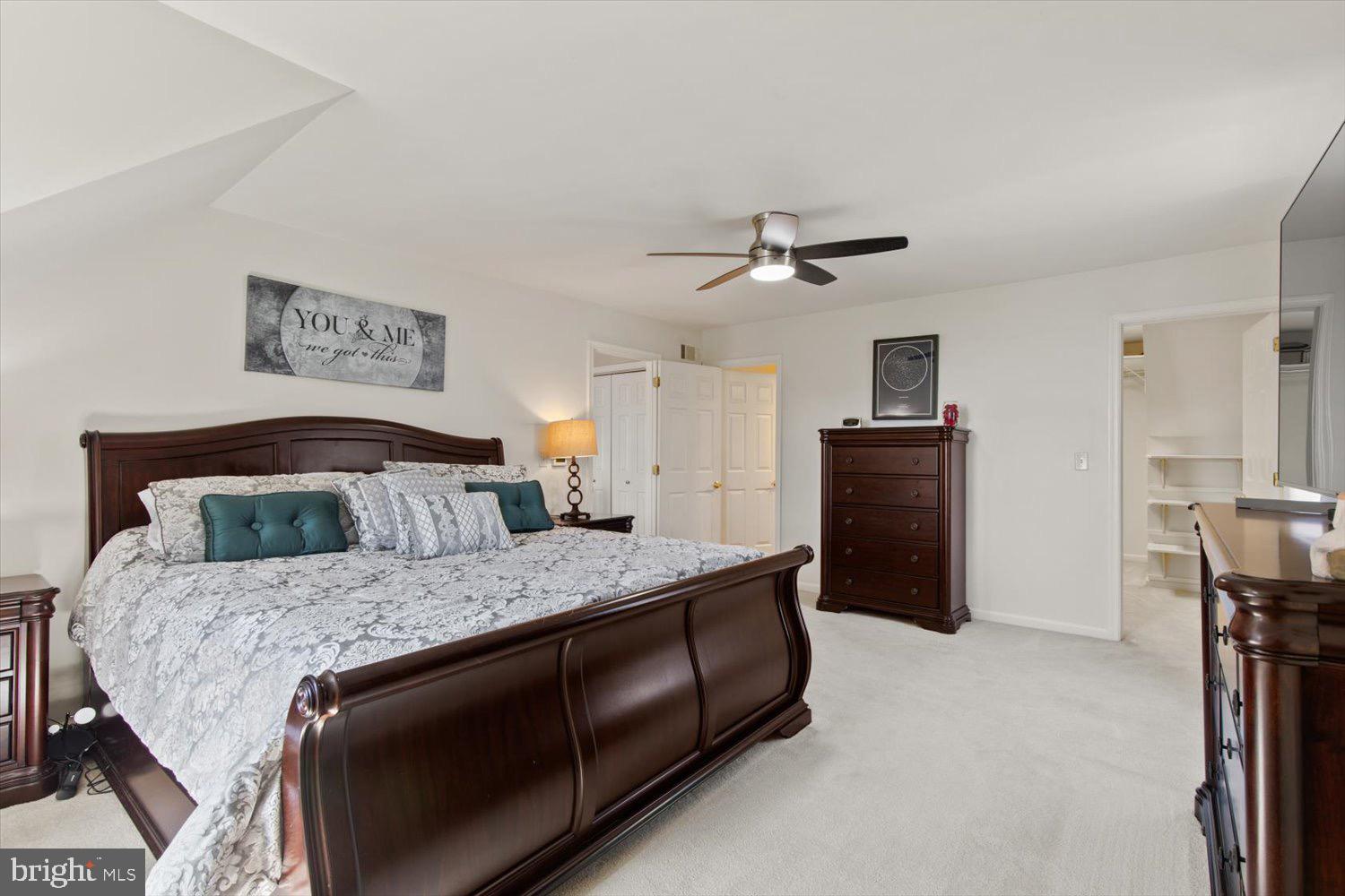 702 Buckwood Lane Lititz, PA 17543 - Photo 32 of 64 a bedroom with a bed and a chandelier