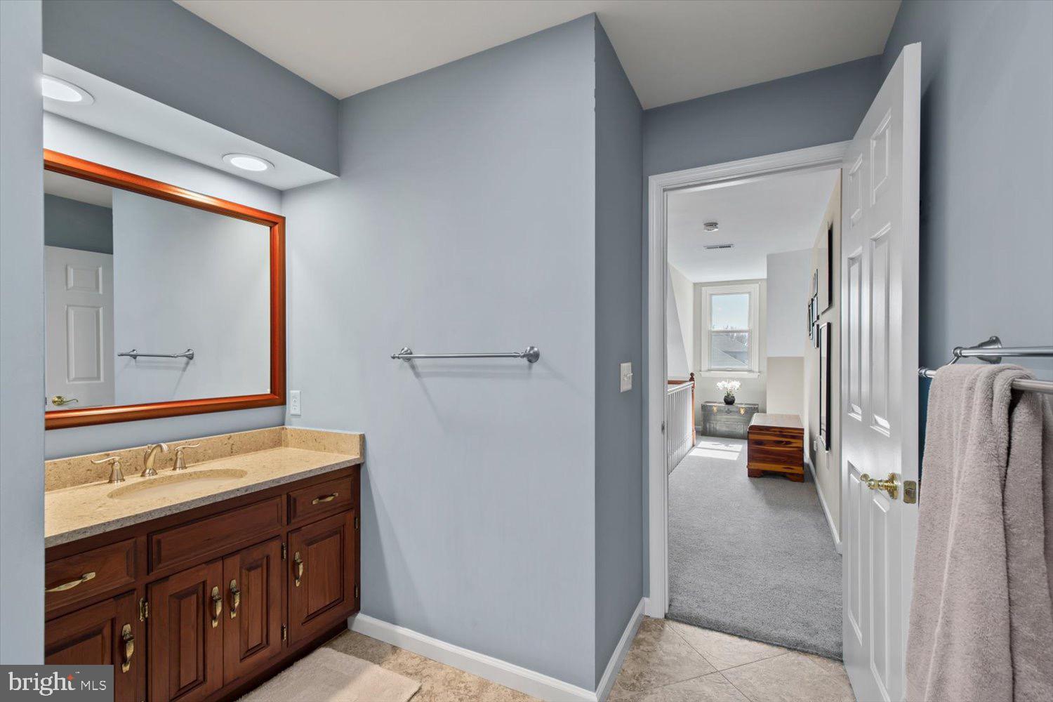 702 Buckwood Lane Lititz, PA 17543 - Photo 42 of 64 a bathroom with a sink a mirror and a shower