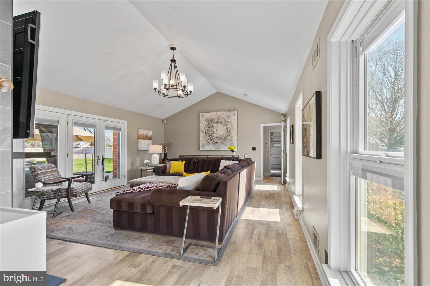 702 Buckwood Lane Lititz, PA 17543 - Photo 45 of 64 a bed room with a bed couch and a chandelier